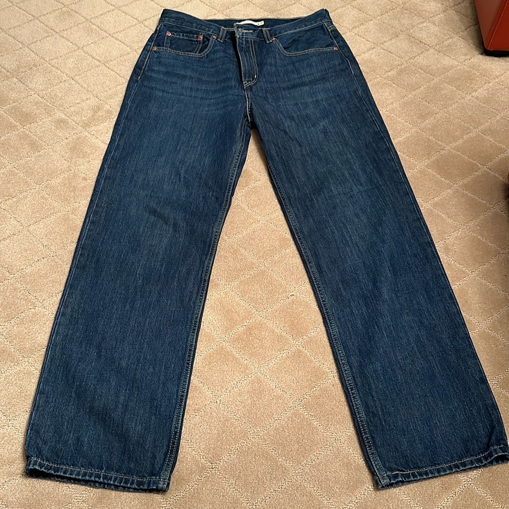 Levi low waisted dark denim jeans. Never worn. Brand new. Low pro straight